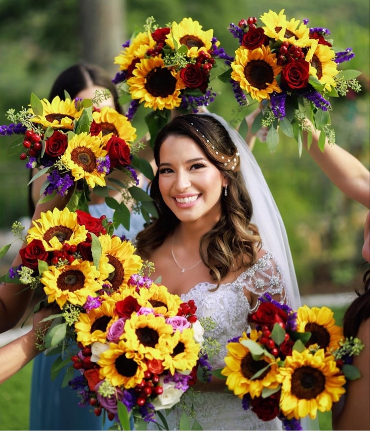 Bride holding sunflower bouquet